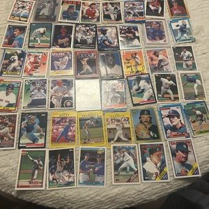 This 54-piece sports trading card lot features some of the most iconic baseball.